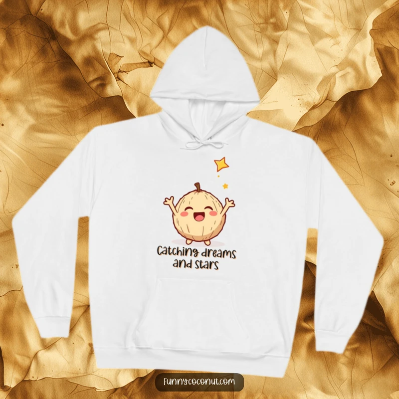 Funny hoodie depicting a delighted coconut gleefully catching a shooting star with outstretched arms, radiating pure happiness.