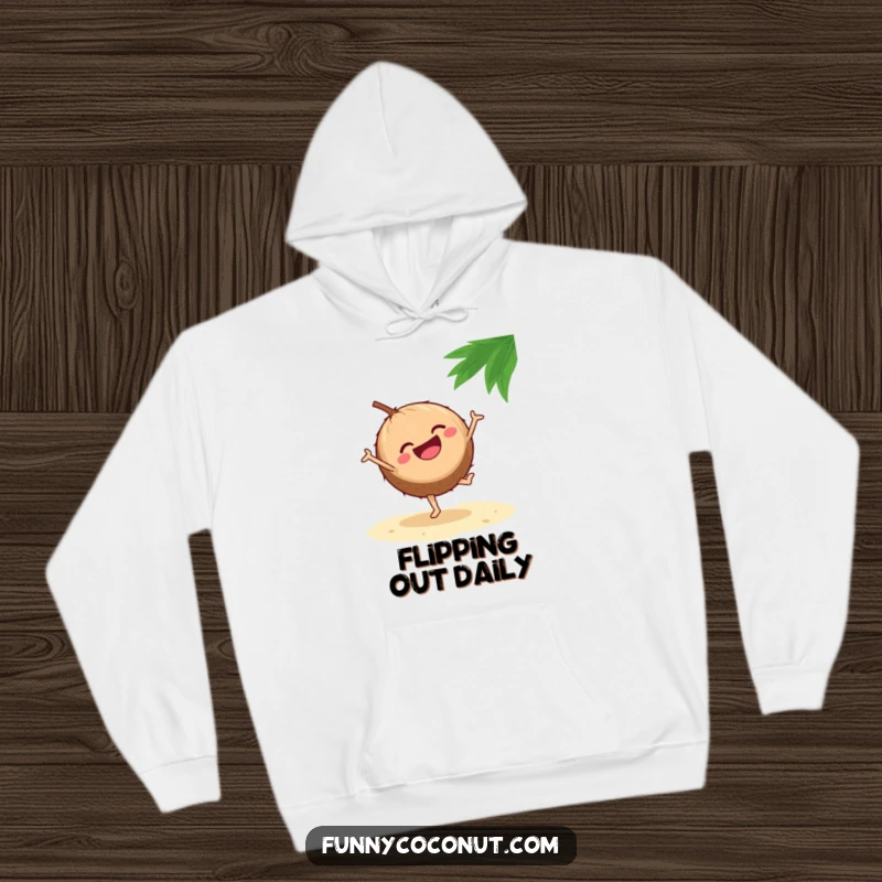 Funny hoodie illustrating a laughing coconut energetically doing a cartwheel on a sandy beach, capturing a moment of pure fun.