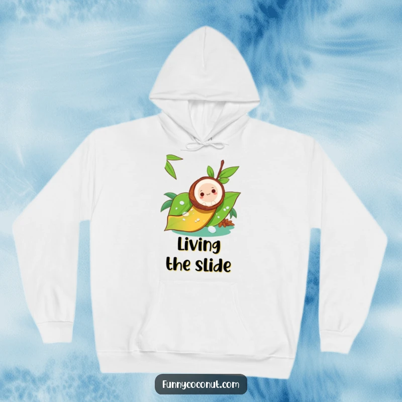 Funny hoodie design of a coconut sliding down a dewy leaf, like a thrilling natural slide, perfect for cozy adventures.