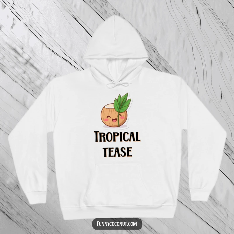 Funny coconut hoodie showing a laughing coconut character peeking out from behind a small, tropical leaf, warm and inviting.