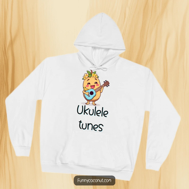 Funny hooded sweatshirt featuring a jovial coconut character wearing a lei and playing a ukulele.
