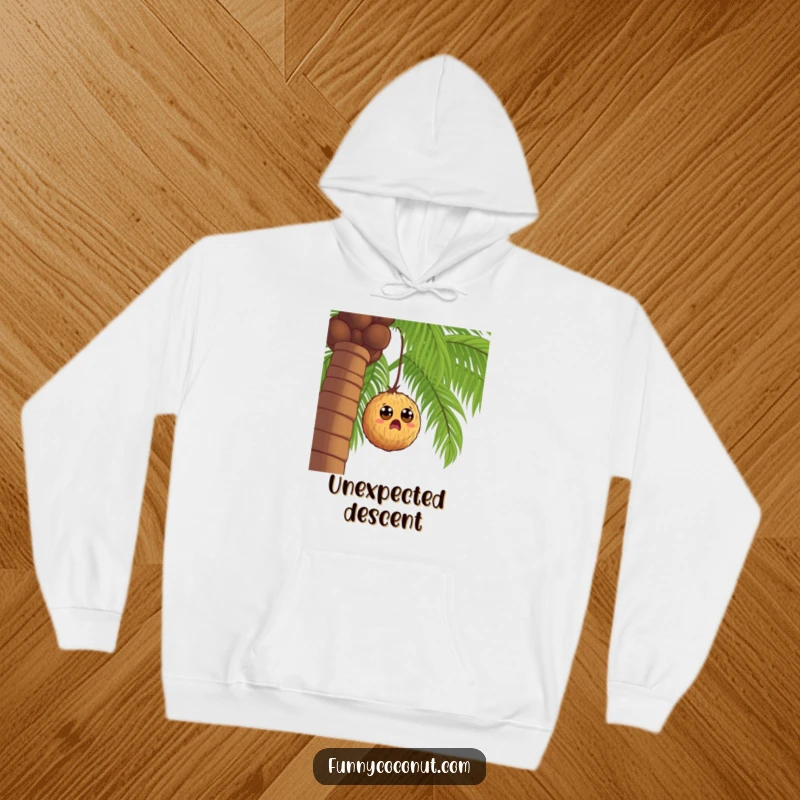 Funny wide-eyed coconut falling from a palm tree, a humorous hoodie capturing a moment of shock and surprise.