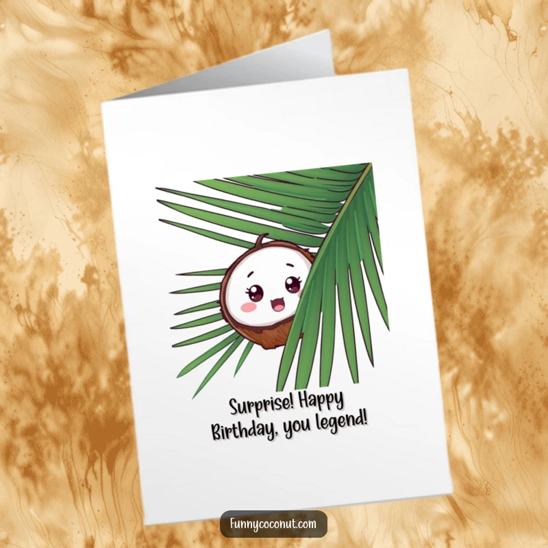 Funny free printable birthday card: a surprised coconut peeks from behind a palm frond, playing peek-a-boo.