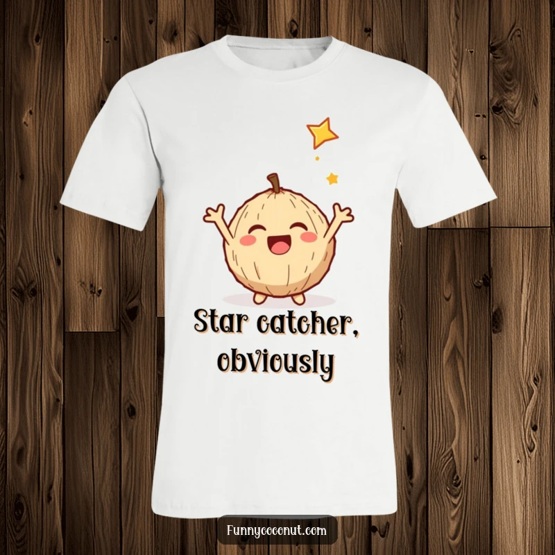 Funny t-shirt showcasing a delighted coconut with arms wide open, joyfully catching a shooting star in a humorous scene.